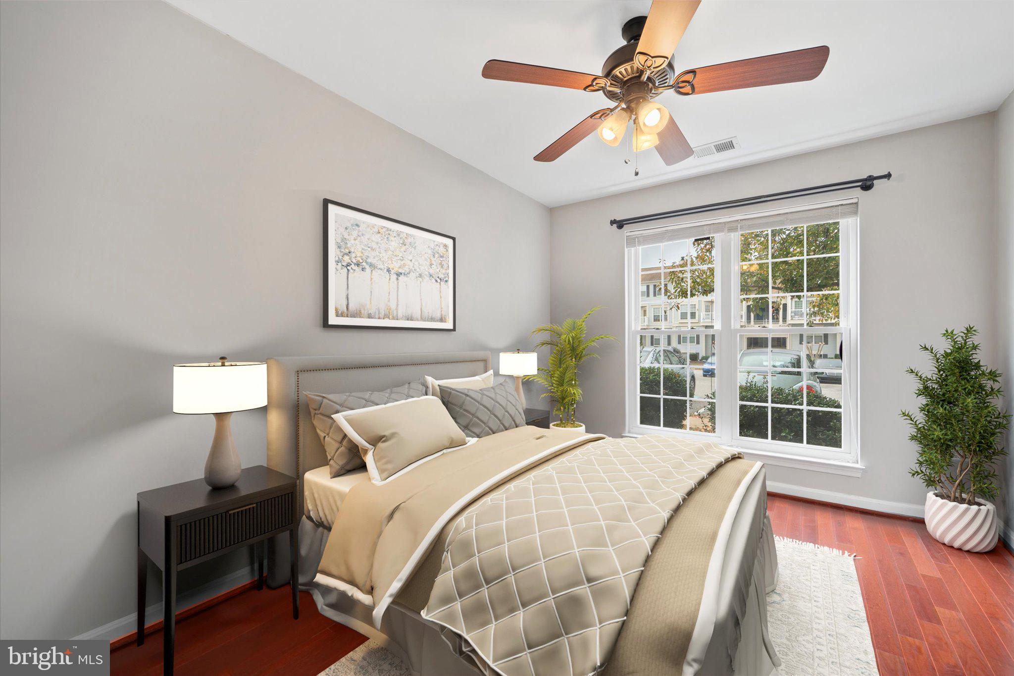 9253 Cardinal Forest Lane, Unit 101 Lorton, VA 22079 - Photo 13 of 29 a bedroom with a balcony a bed and a window