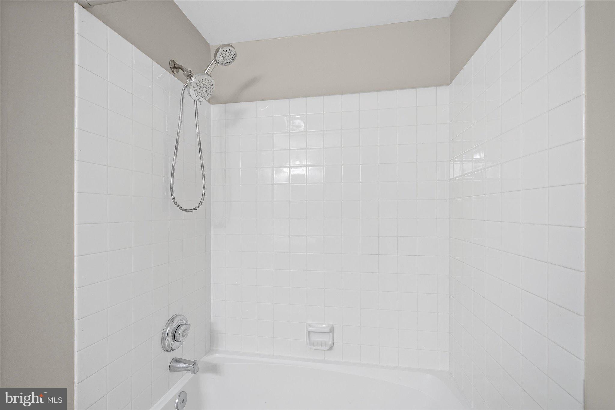 9253 Cardinal Forest Lane, Unit 101 Lorton, VA 22079 - Photo 16 of 29 a bathroom with a shower