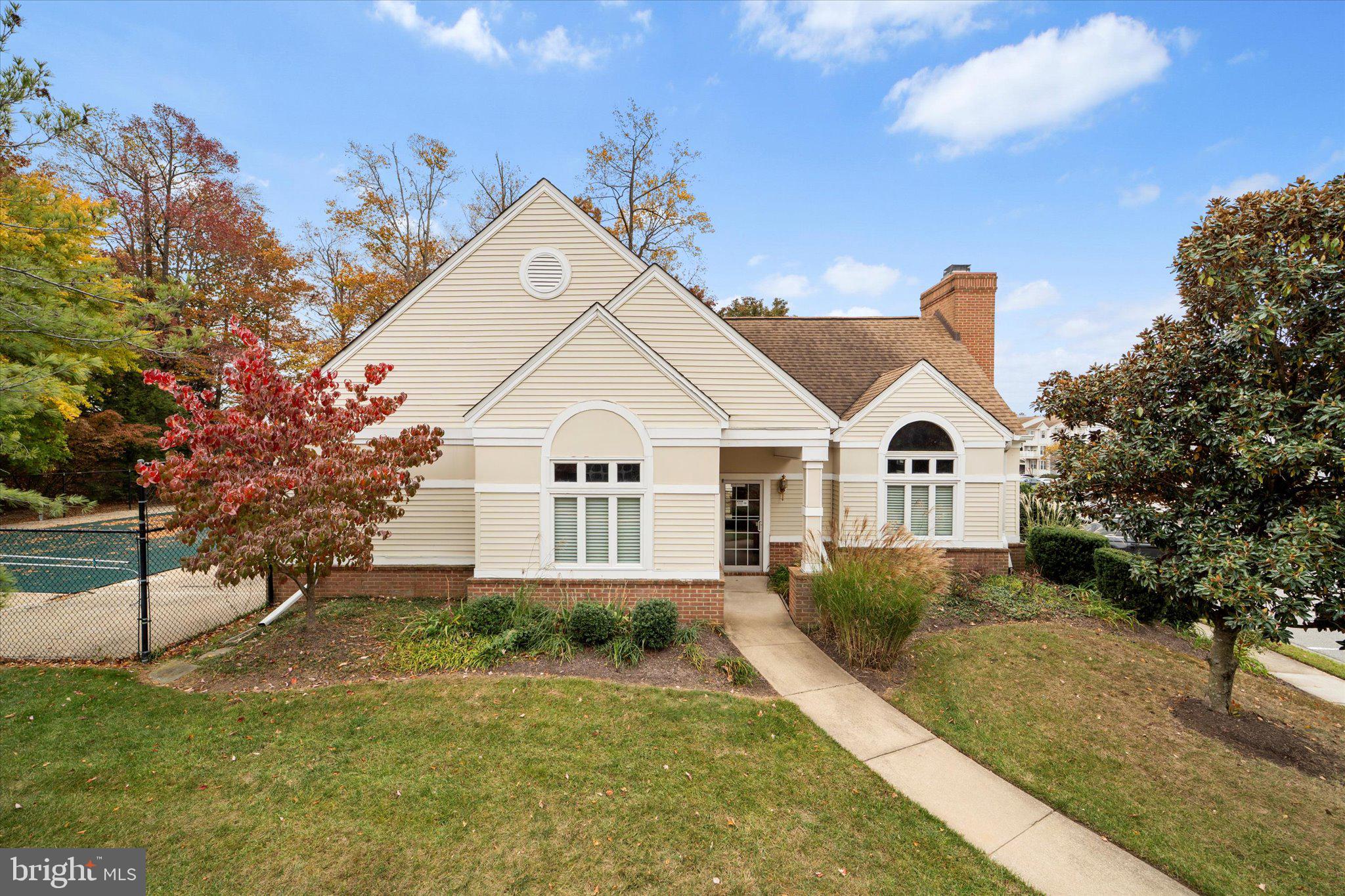 9253 Cardinal Forest Lane, Unit 101 Lorton, VA 22079 - Photo 22 of 29 a view of front of house with a yard