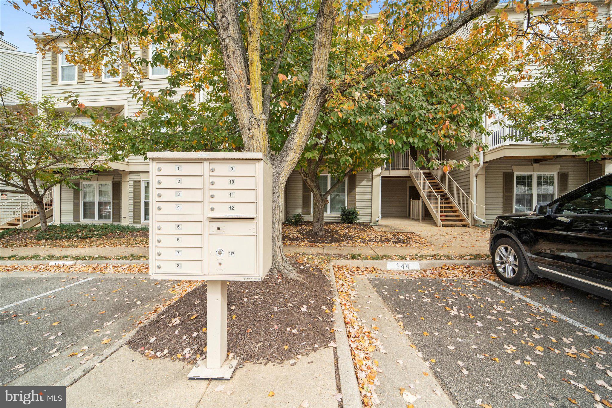 9253 Cardinal Forest Lane, Unit 101 Lorton, VA 22079 - Photo 26 of 29 a view of a car park in front of a house