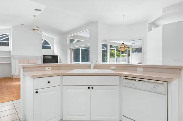a kitchen with a sink and cabinets