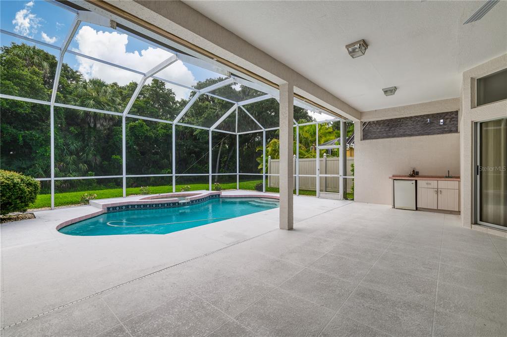 2810 89th Avenue East Parrish, FL 34219 - Photo 2 of 34 a view of a room with a large window and wooden floor