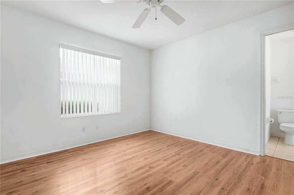 2810 89th Avenue East Parrish, FL 34219 - Photo 22 of 34 an empty room with a bathroom and a window