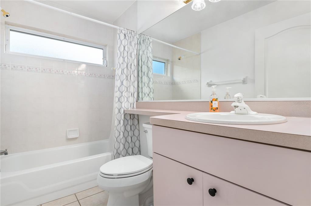 2810 89th Avenue East Parrish, FL 34219 - Photo 25 of 34 a bathroom with a sink toilet and shower