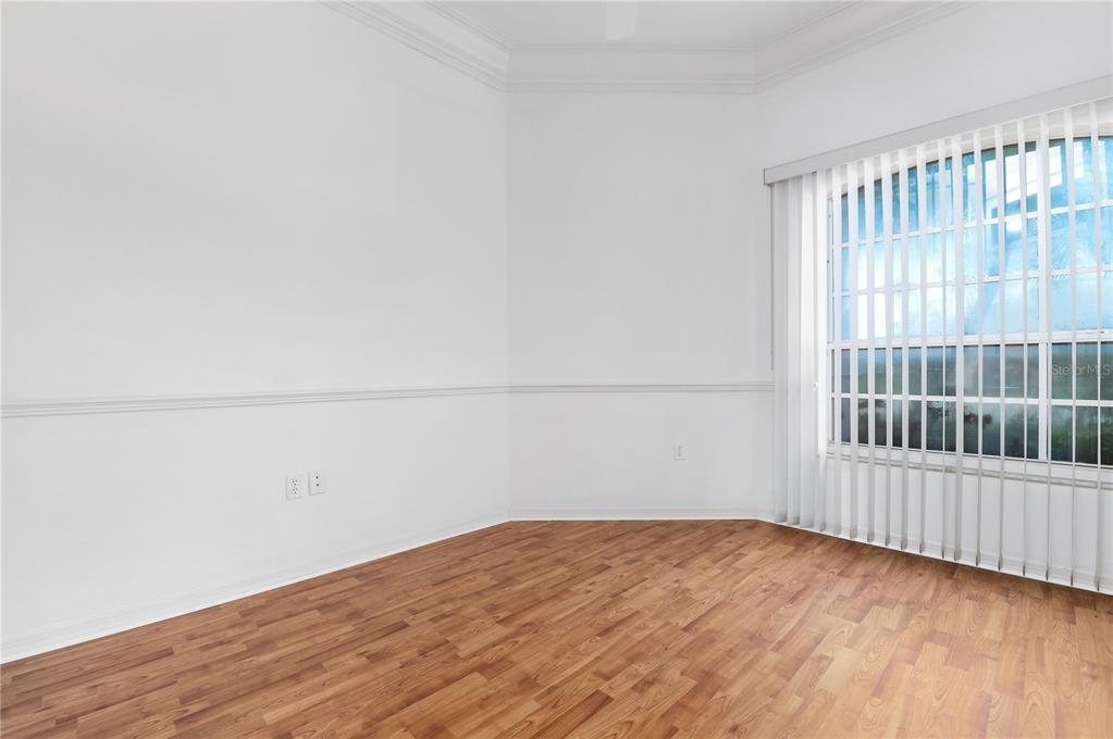2810 89th Avenue East Parrish, FL 34219 - Photo 26 of 34 an empty room with wooden floor