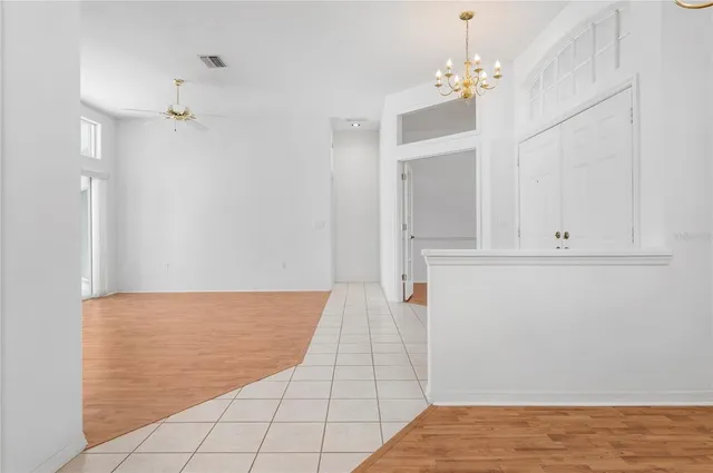 a view of room with hardwood floor and cabinet