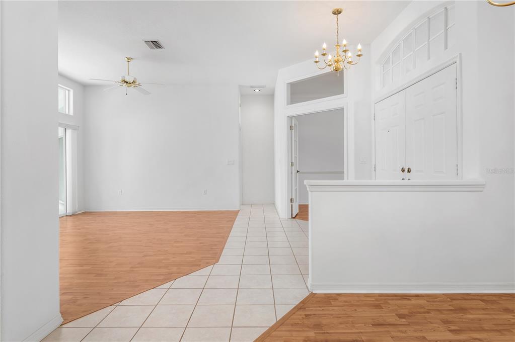 2810 89th Avenue East Parrish, FL 34219 - Photo 10 of 34 a view of room with hardwood floor and cabinet