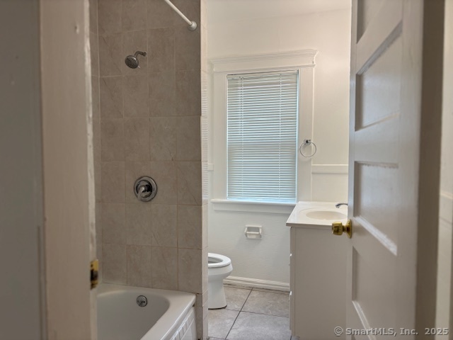 64 Wade Street, Unit 1 Bridgeport, CT 06604 - Photo 14 of 22 a bathroom with a granite countertop sink a toilet and shower