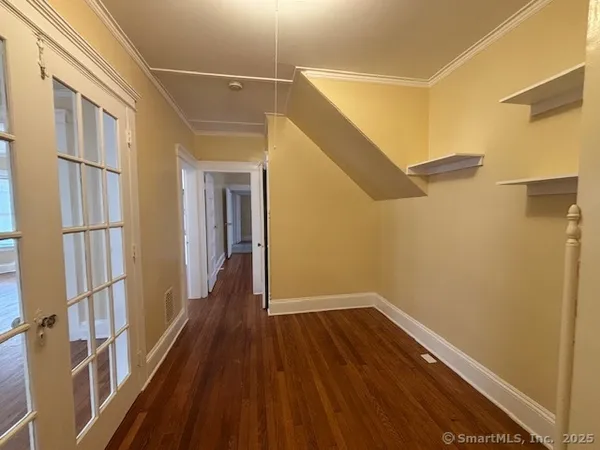 a view of a house with wooden floor and stairs