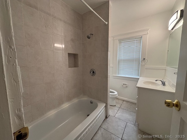 64 Wade Street, Unit 1 Bridgeport, CT 06604 - Photo 15 of 22 a bathroom with a bathtub a toilet and a shower