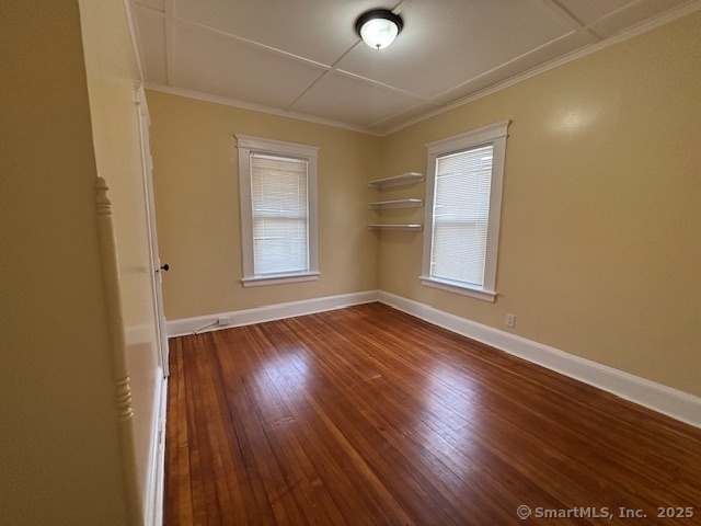 64 Wade Street, Unit 1 Bridgeport, CT 06604 - Photo 16 of 22 an empty room with wooden floor and windows