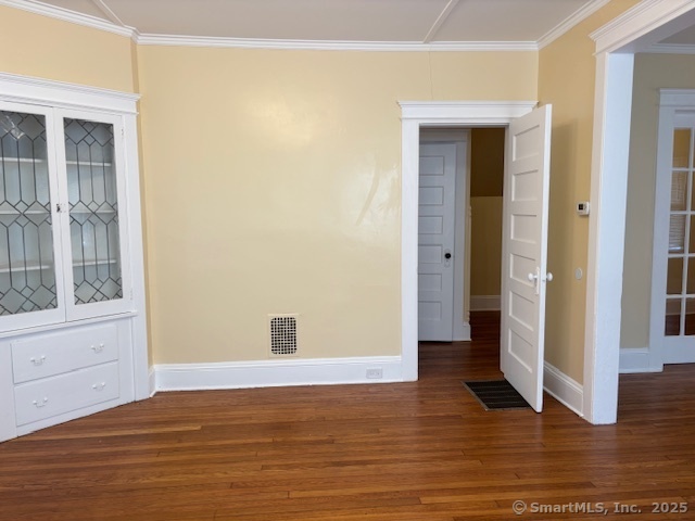 64 Wade Street, Unit 1 Bridgeport, CT 06604 - Photo 21 of 22 a view of an empty room with wooden floor and a window