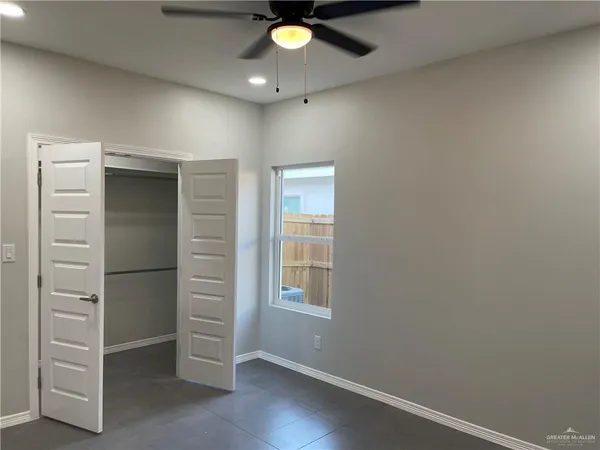 a view of an empty room with a window
