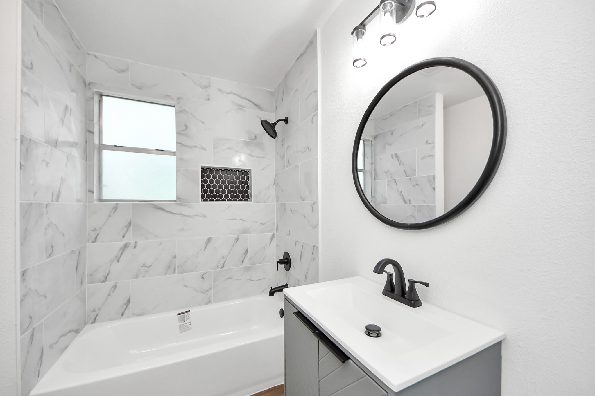 207 East Defee Avenue Baytown, TX 77520 - Photo 22 of 36 a bathroom with a sink and a mirror