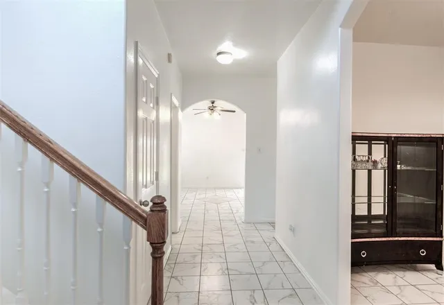a view of a hallway with a living room