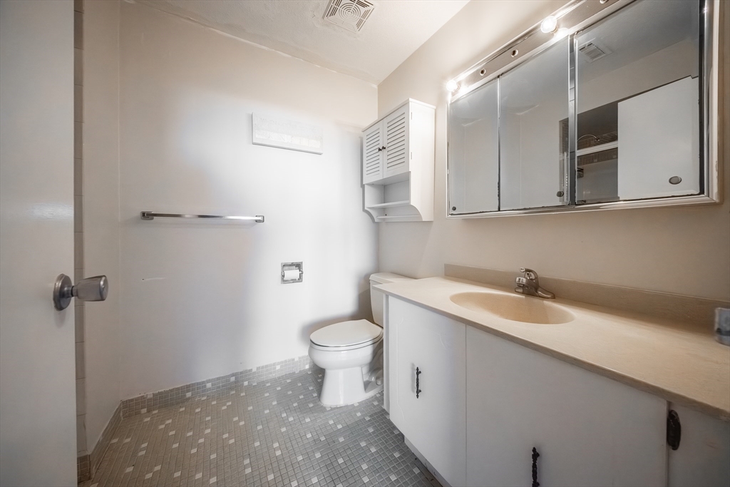 1002 Paradise Road, Unit PHE Swampscott, MA 01907 - Photo 19 of 23 a bathroom with a sink and a toilet