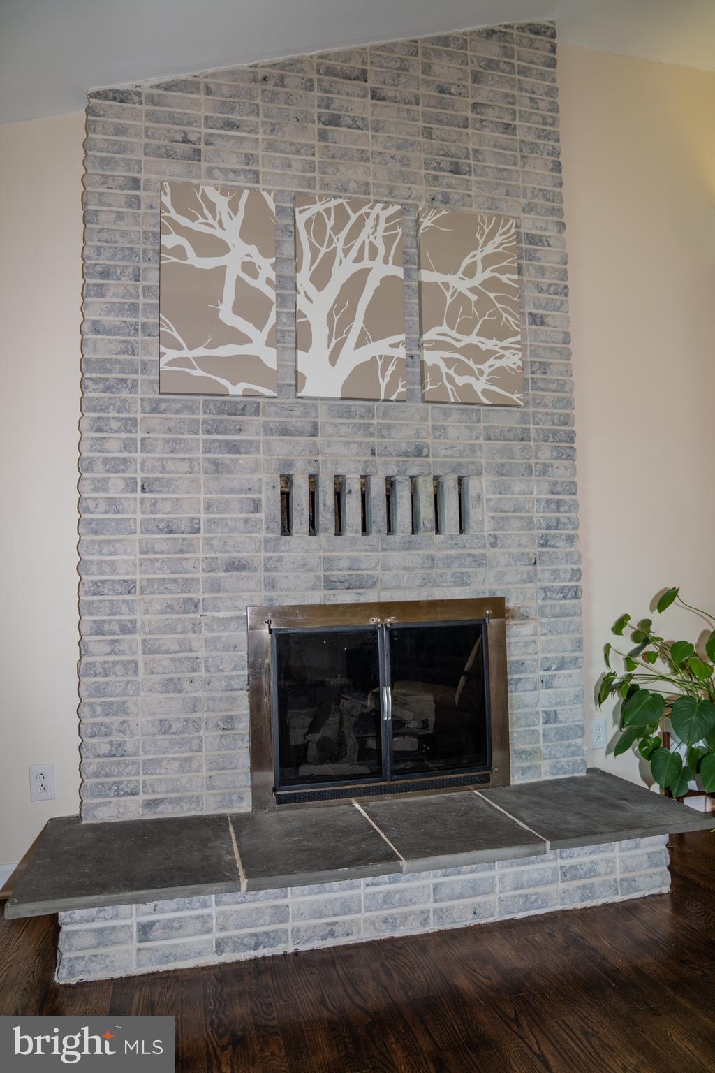 1809 Franwall Avenue Silver Spring, MD 20902 - Photo 6 of 36 Gas fireplace with floor to ceiling brick surround