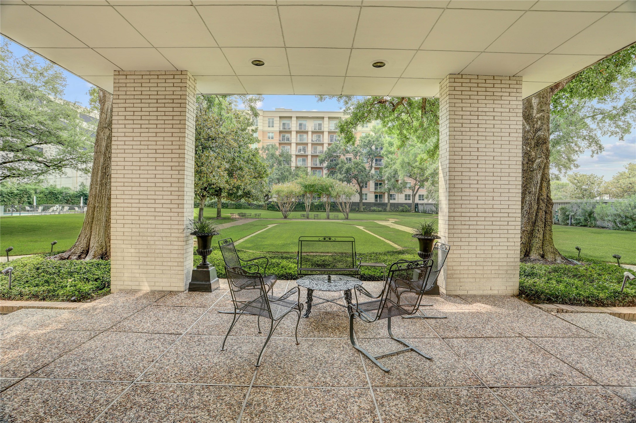 2701 Westheimer Road, Unit 12E Houston, TX 77098 - Photo 22 of 31 a chair and table in a backyard