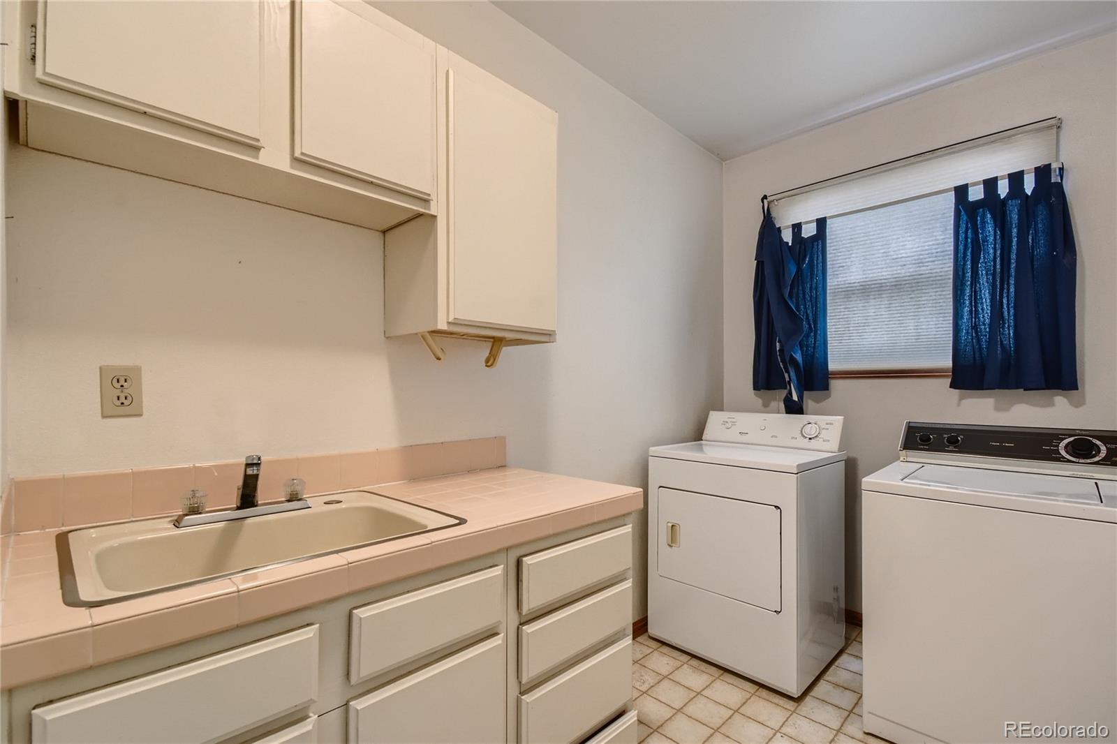 7 Red Maple Place Littleton, CO 80127 - Photo 12 of 28 a utility room with dryer and washer