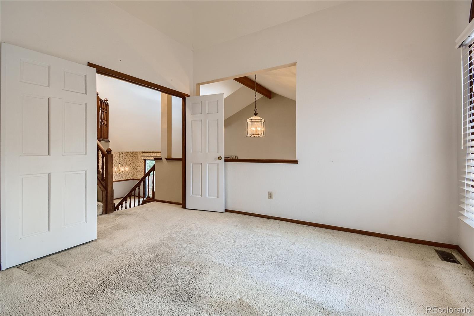 7 Red Maple Place Littleton, CO 80127 - Photo 14 of 28 an empty room with windows and closet