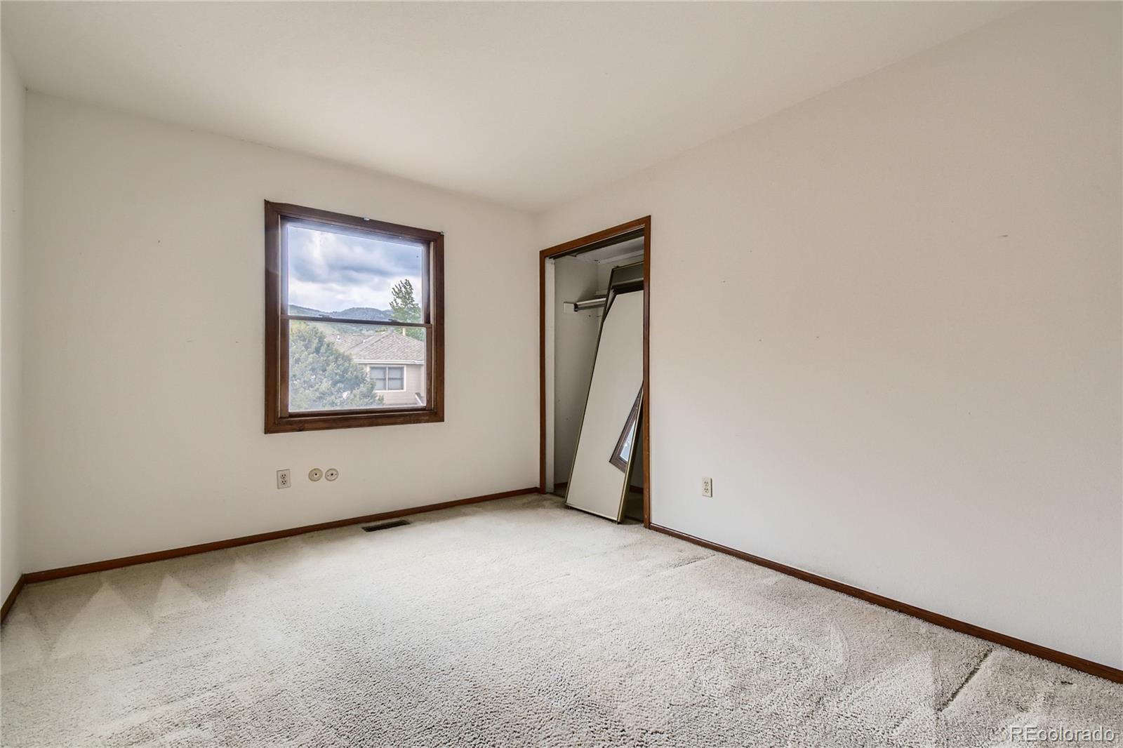 7 Red Maple Place Littleton, CO 80127 - Photo 18 of 28 a view of an empty room with a window