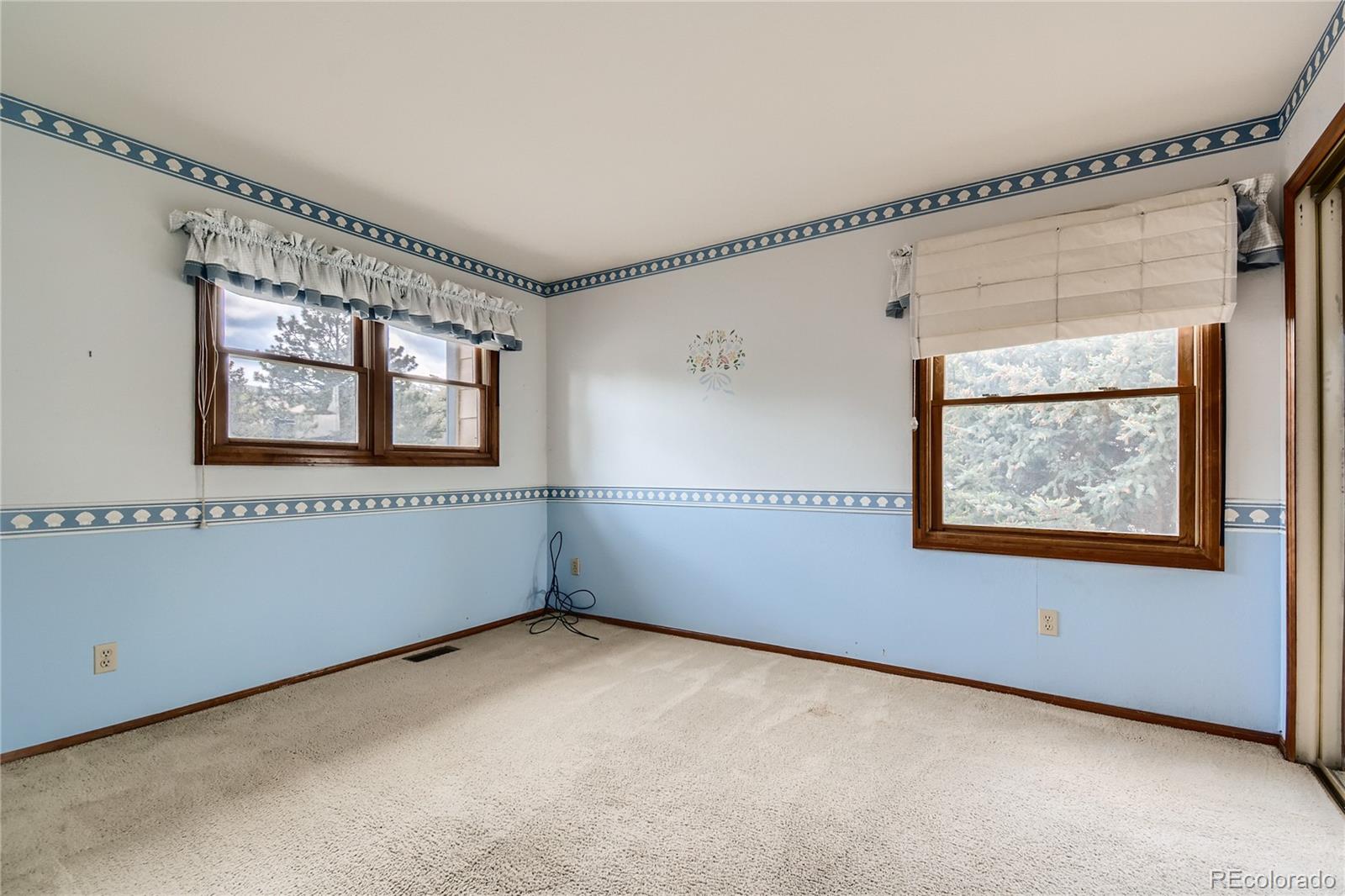 7 Red Maple Place Littleton, CO 80127 - Photo 21 of 28 a view of an empty room with a window