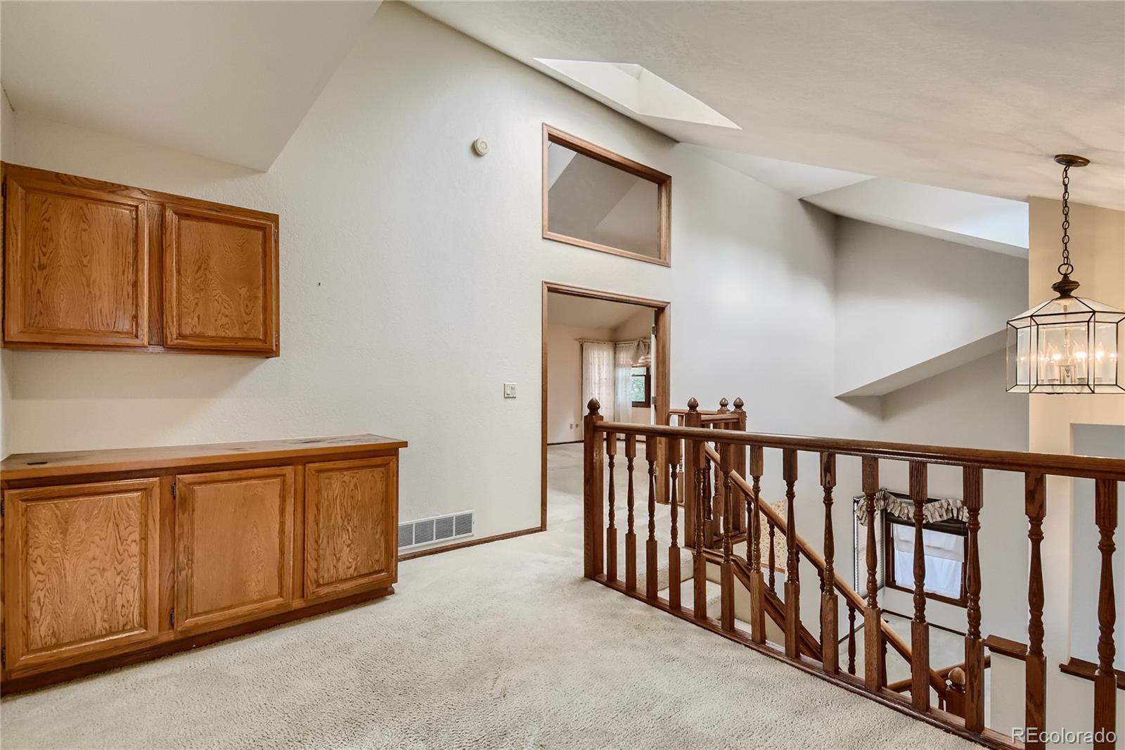 7 Red Maple Place Littleton, CO 80127 - Photo 22 of 28 a view of a hallway with entryway door