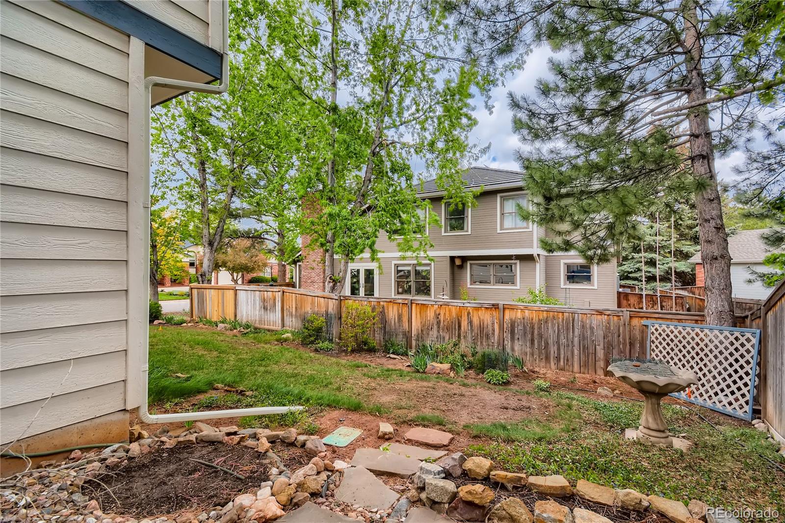 7 Red Maple Place Littleton, CO 80127 - Photo 28 of 28 a front view of a house with a yard