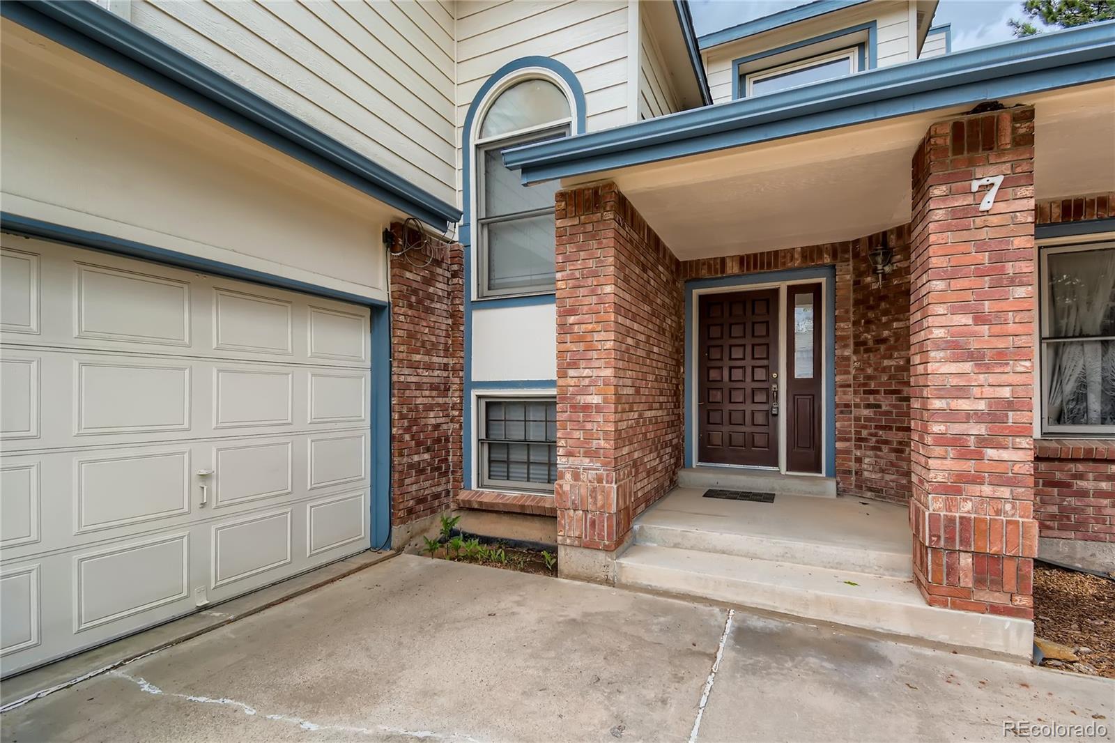 7 Red Maple Place Littleton, CO 80127 - Photo 3 of 28 a view of a house with a door and a window