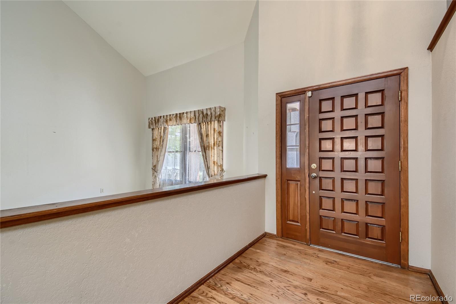7 Red Maple Place Littleton, CO 80127 - Photo 4 of 28 wooden floor in an empty room