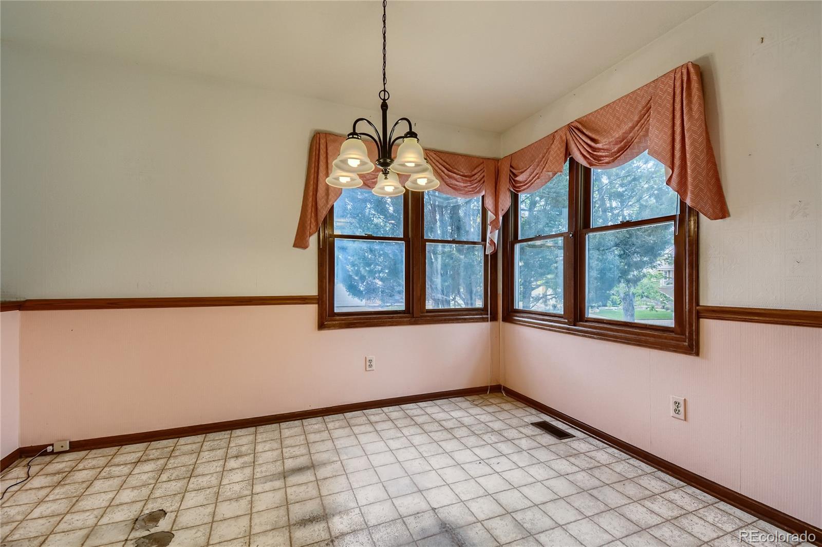 7 Red Maple Place Littleton, CO 80127 - Photo 10 of 28 a view of an empty room with a window