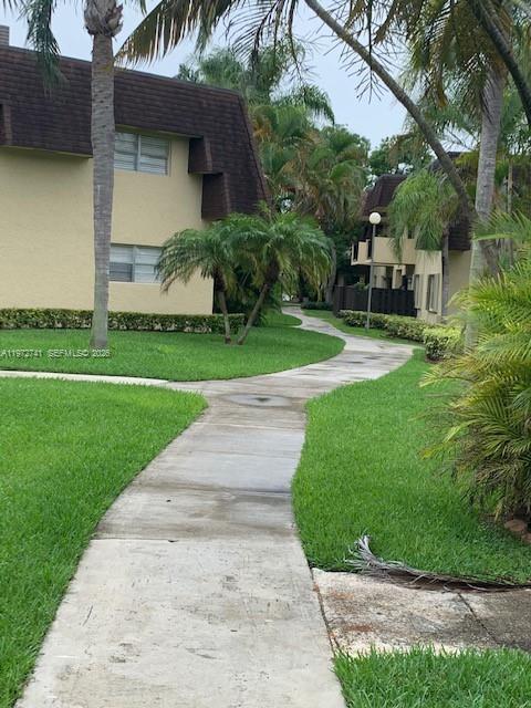 13714 Southwest 90th Avenue, Unit 25 Miami, FL 33176 - Photo 15 of 15 a view of a patio with a yard