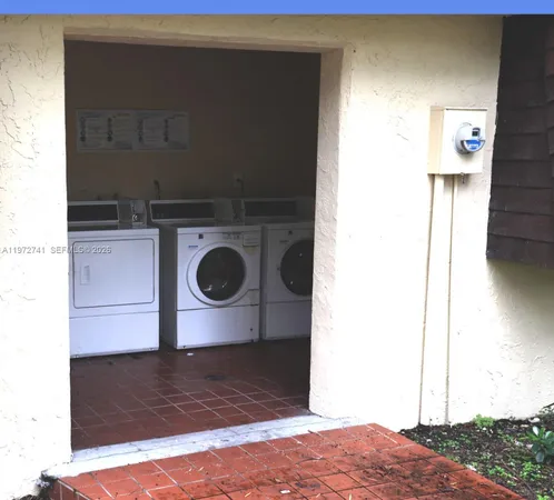 a view of storage and utility room with washer and dryer