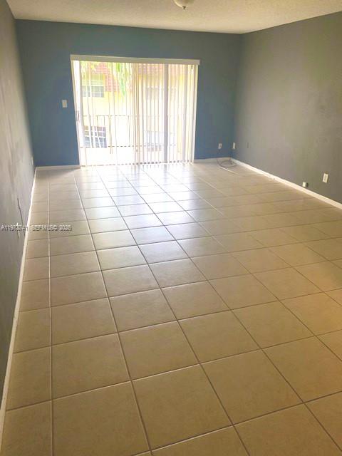 13714 Southwest 90th Avenue, Unit 25 Miami, FL 33176 - Photo 7 of 15 a view of an empty room with a window