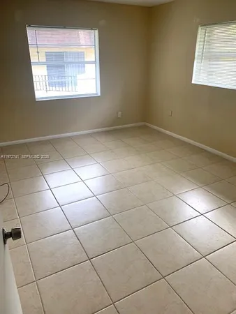 a bathroom with a toilet and a bathtub