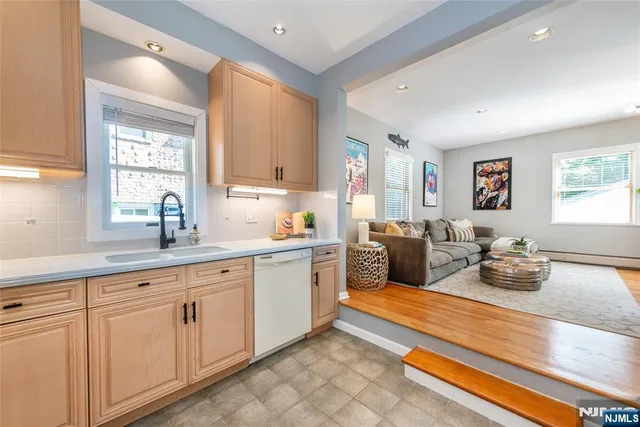 a living room with furniture window and wooden floor