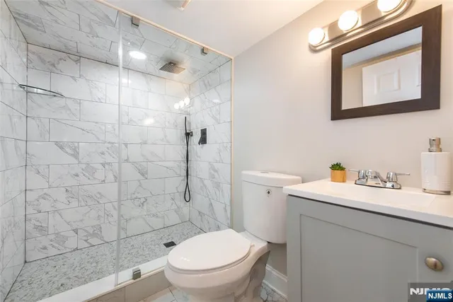 a view of a room with furniture and wooden floor