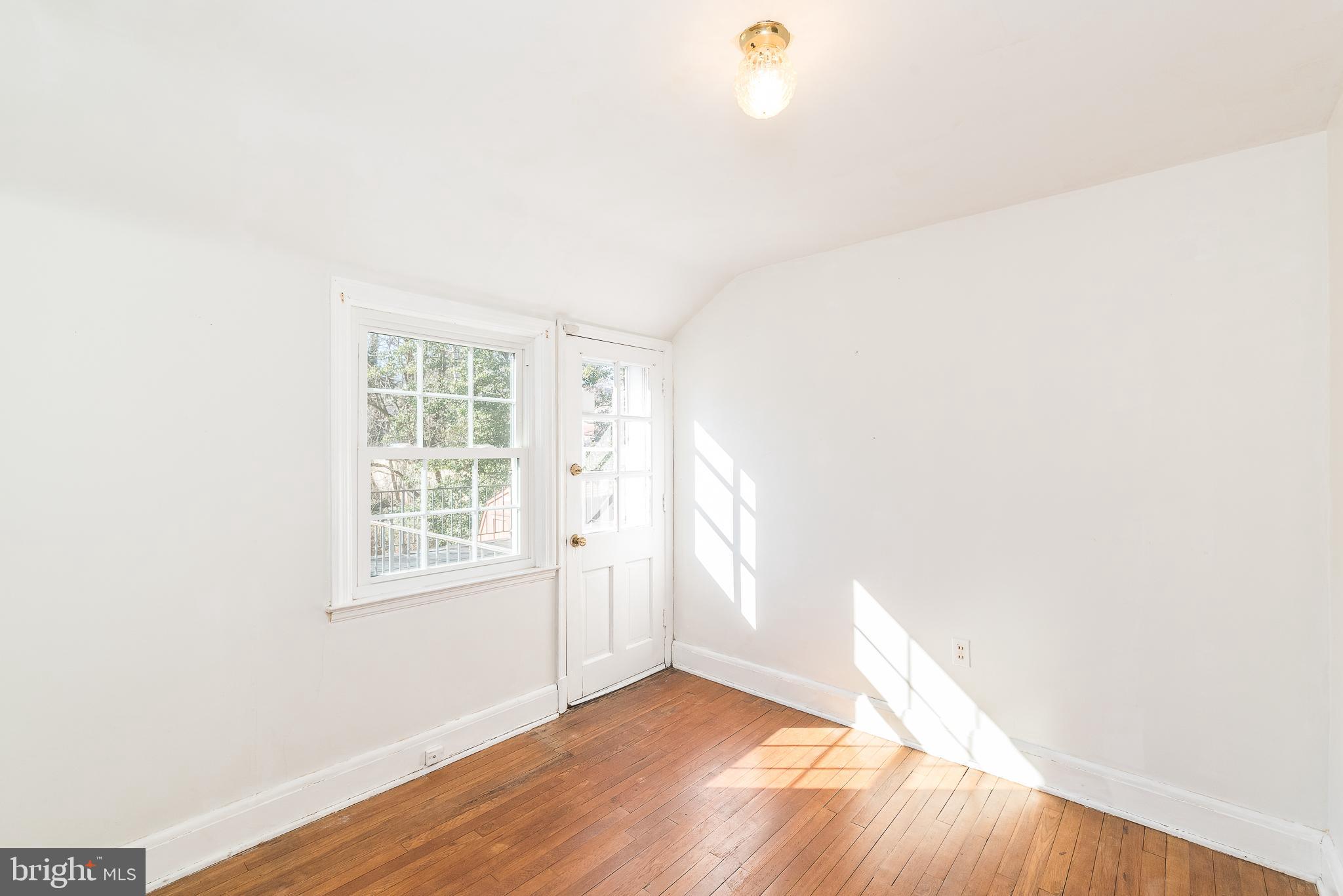 605 Cedarcroft Road Baltimore, MD 21212 - Photo 34 of 63 Smallest bedroom has door leading to balcony