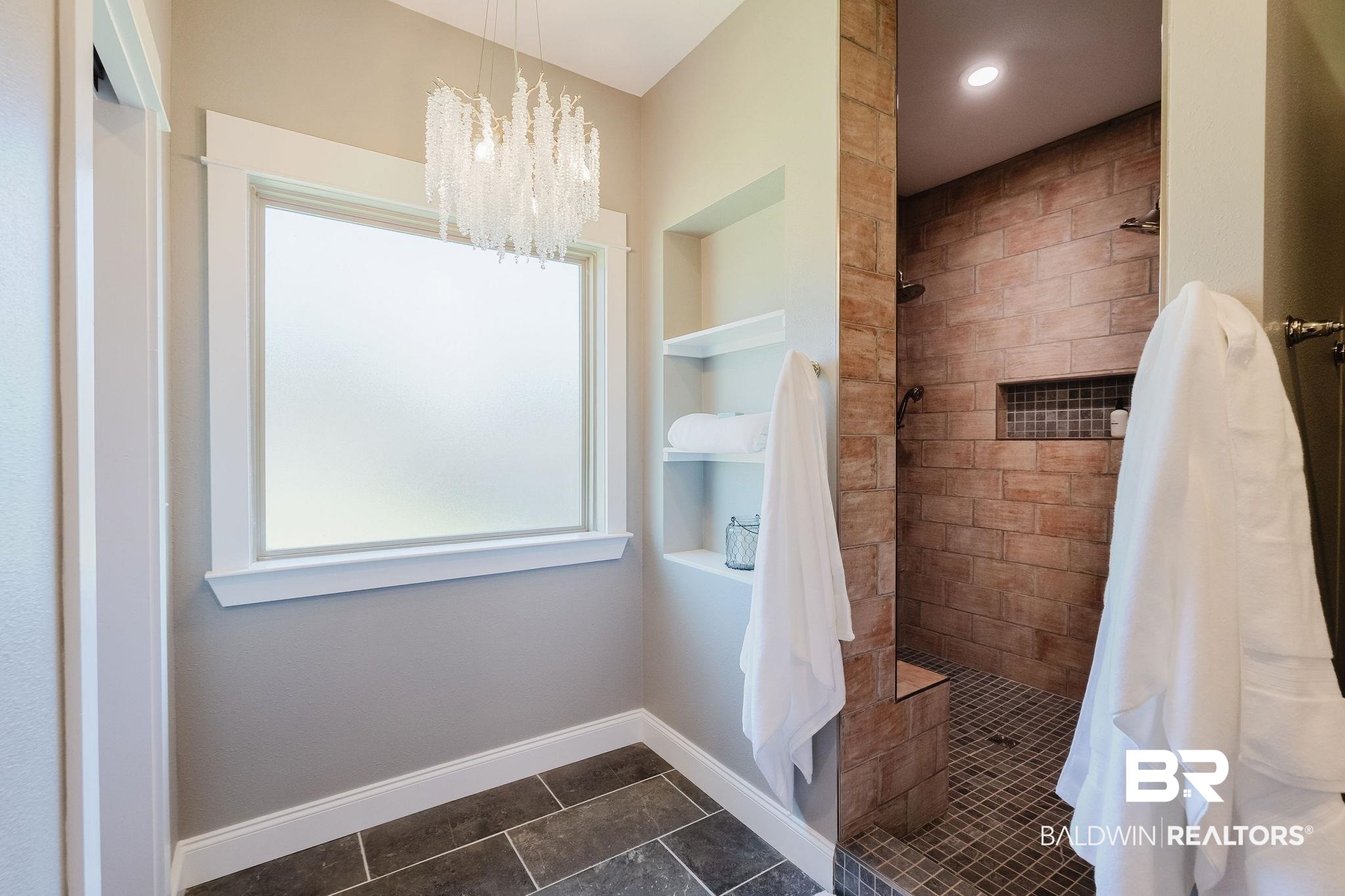 7872 Calverton Street Foley, AL 36535 - Photo 19 of 76 Spacious walk-in shower with brick-style wall tile and dark mosaic floor tile