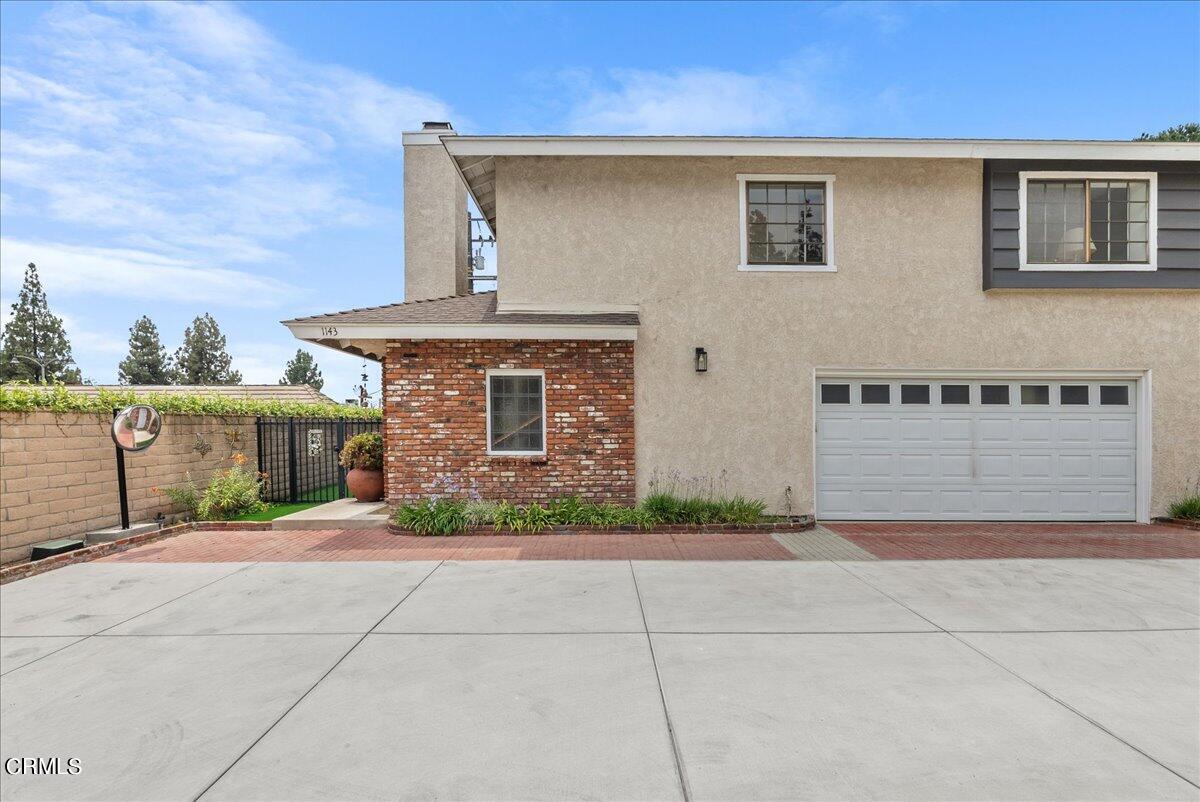 1143 Highland Avenue Duarte, CA 91010 - Photo 1 of 33 a front view of a house with a garage