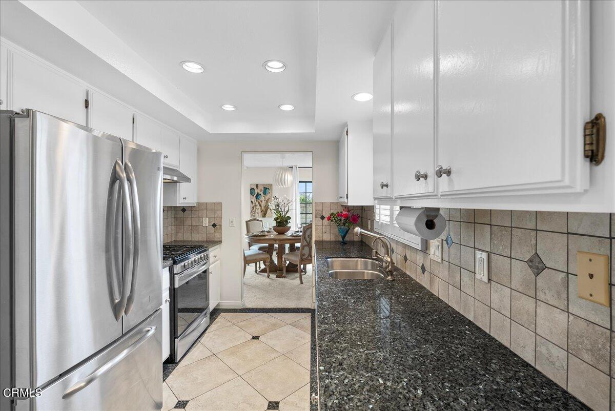 1143 Highland Avenue Duarte, CA 91010 - Photo 12 of 33 a kitchen with stainless steel appliances granite countertop a refrigerator and a stove top oven