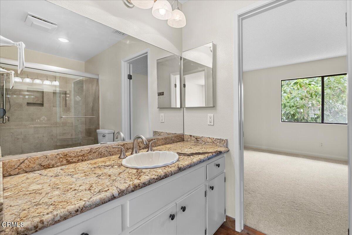 1143 Highland Avenue Duarte, CA 91010 - Photo 19 of 33 a bathroom with a sink double vanity granite and a shower