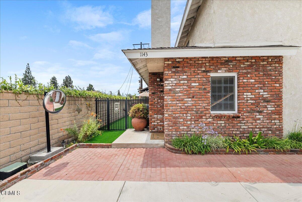 1143 Highland Avenue Duarte, CA 91010 - Photo 2 of 33 a front view of a house with a yard and potted plants