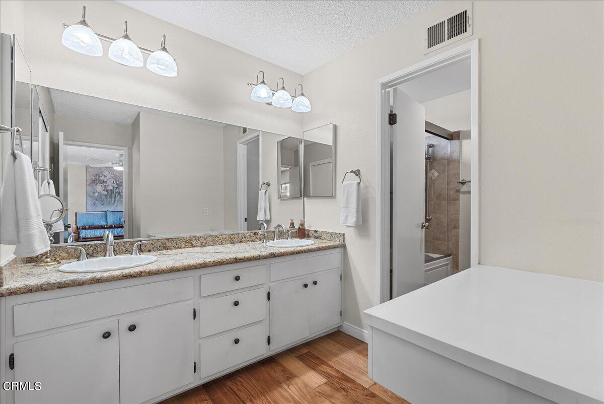 1143 Highland Avenue Duarte, CA 91010 - Photo 25 of 33 a bathroom with a granite countertop double vanity sink and mirror
