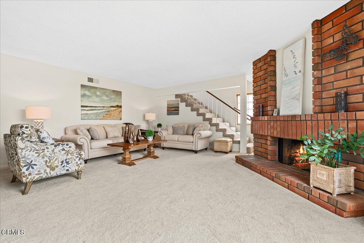 1143 Highland Avenue Duarte, CA 91010 - Photo 6 of 33 a living room with furniture and a fireplace