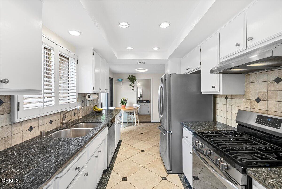 1143 Highland Avenue Duarte, CA 91010 - Photo 10 of 33 a kitchen with a stove a sink and a refrigerator