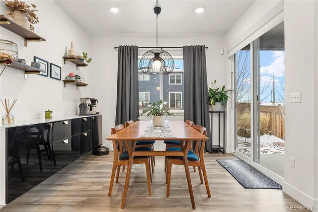 a view of a dining room with furniture window and wooden floor