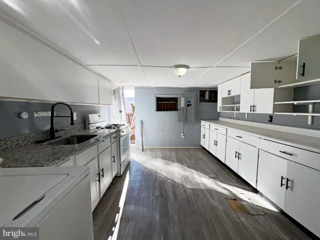 a large kitchen with cabinets