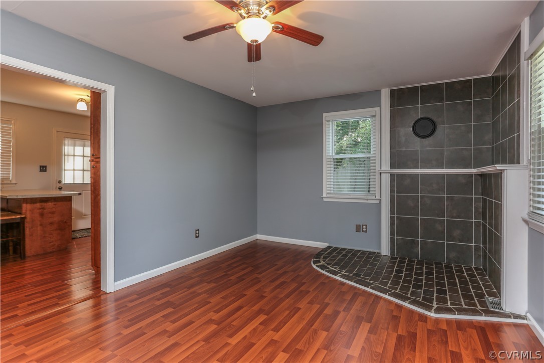 14104 South Hackberry Road Chester, VA 23836 - Photo 14 of 27 a view of empty room with wooden floor and fan