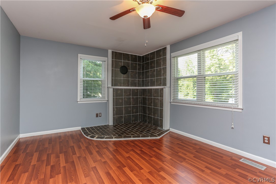 14104 South Hackberry Road Chester, VA 23836 - Photo 16 of 27 a view of a room with window wooden floor and outside view
